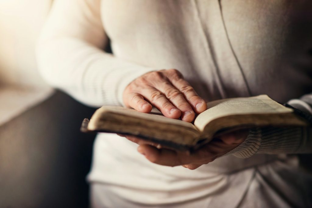A person holding a bible