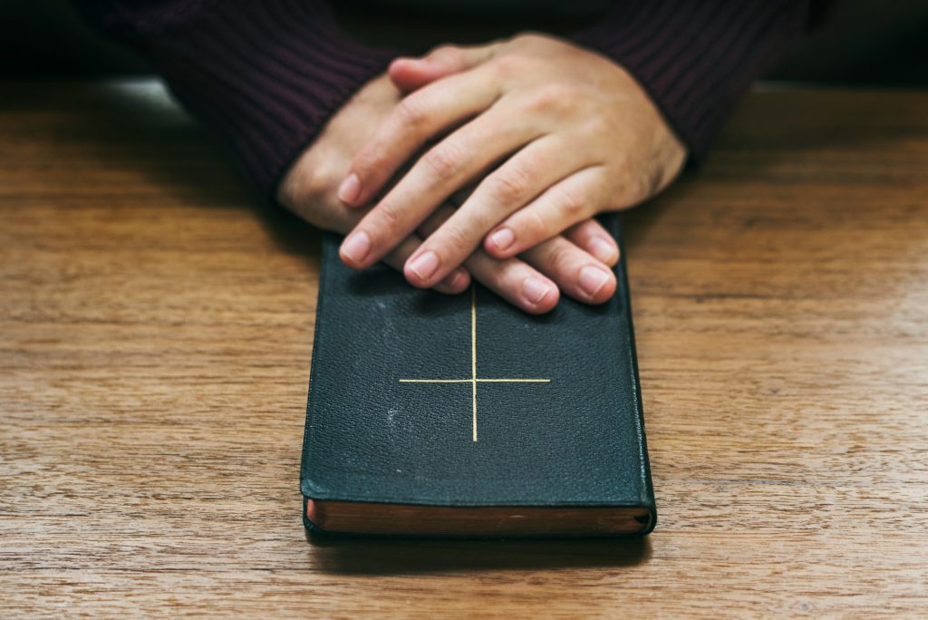 An open Bible representing the meaning of discernment in the Bible and the importance of seeking God’s wisdom when facing uncertainty, competing voices, and difficult decisions. This NowAskJesus article explores biblical discernment, prayer, Scripture, and learning to recognize what is true.
